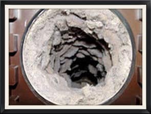 Dryer Vent Cleaning | Olsen Brothers Window Cleaning a picture of a dirty dryer vent that needs cleaning